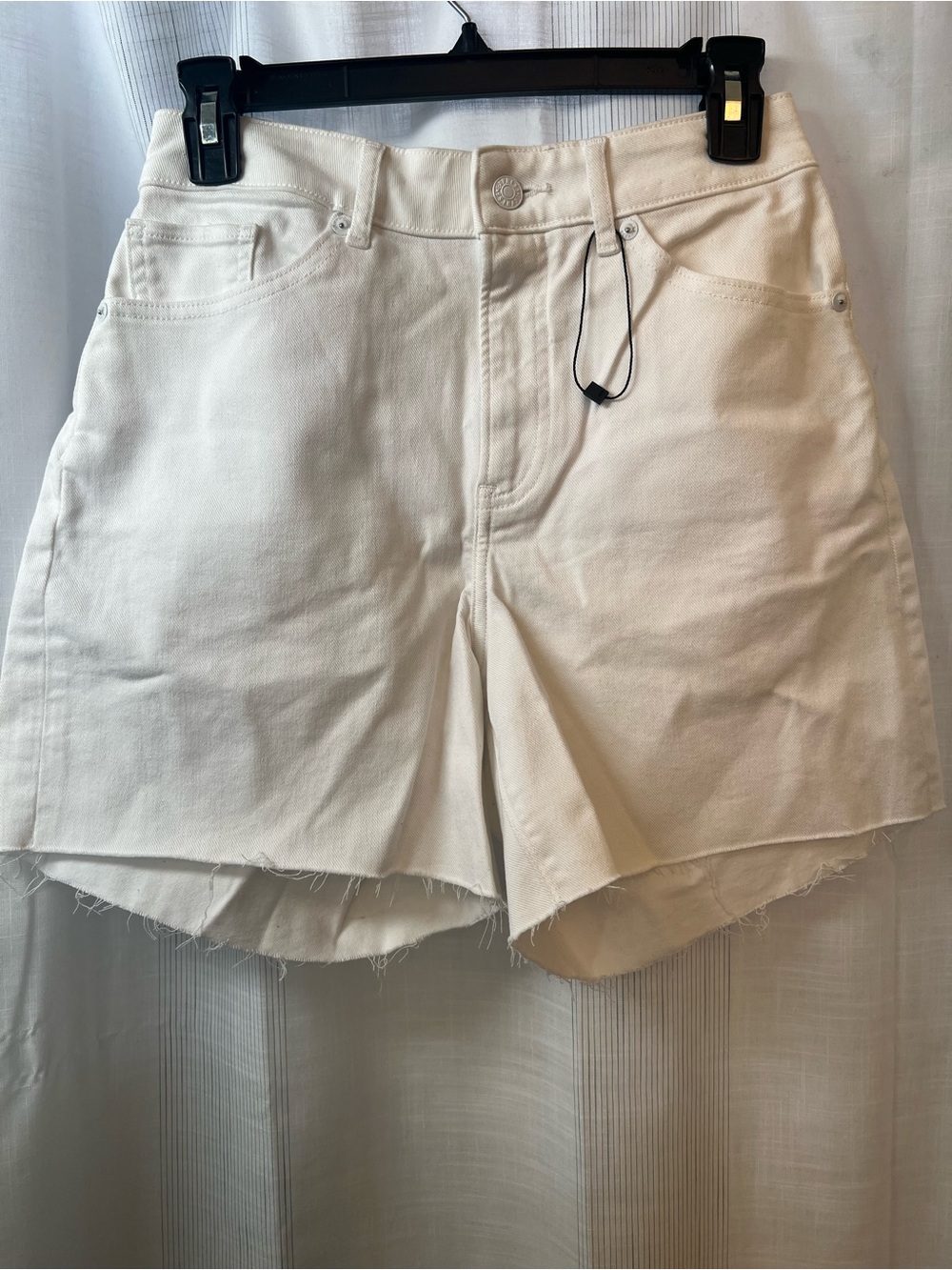 NWT Express Long White Shorts! So in right now with short trends